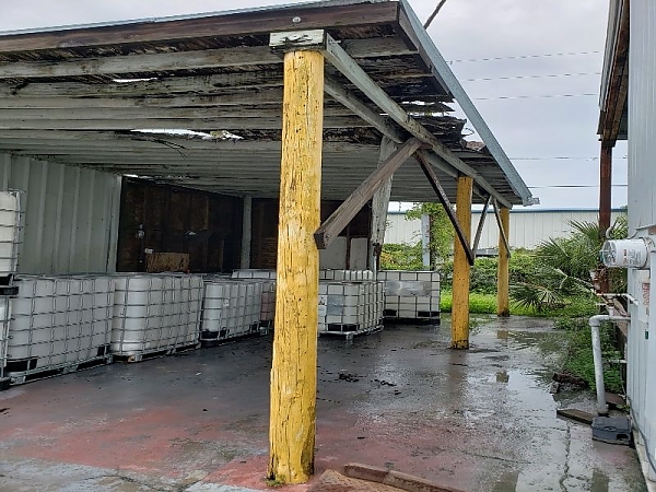 Badly Damaged Roof and Failing Structural Framing